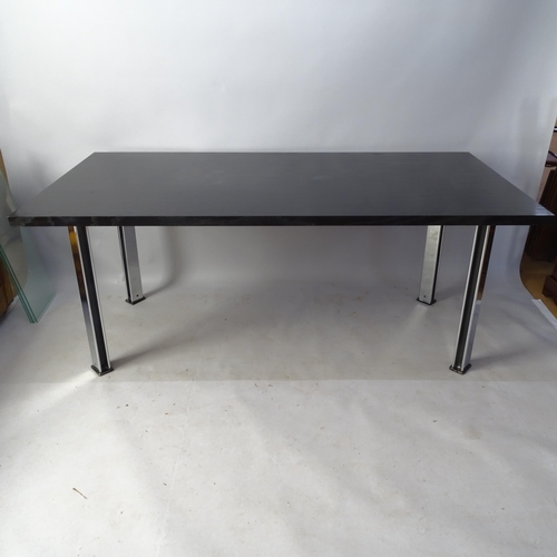 2022 - A Pieff dining table, the black top on black and chrome steel legs, 180 x 74 x 90cm