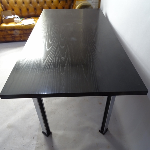 2022 - A Pieff dining table, the black top on black and chrome steel legs, 180 x 74 x 90cm