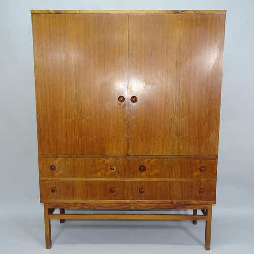 2015 - A Mid-century Danish rosewood drinks cabinet, the oask lined interior fitted with drawers and glass ... 