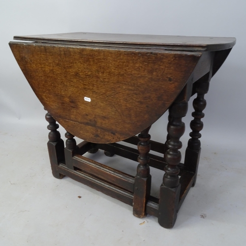 2038 - An Antique oak oval gateleg drop leaf table, 74cm x 62cm x 42cm