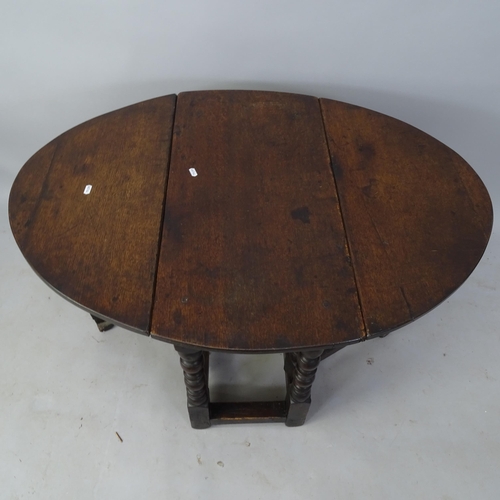 2038 - An Antique oak oval gateleg drop leaf table, 74cm x 62cm x 42cm