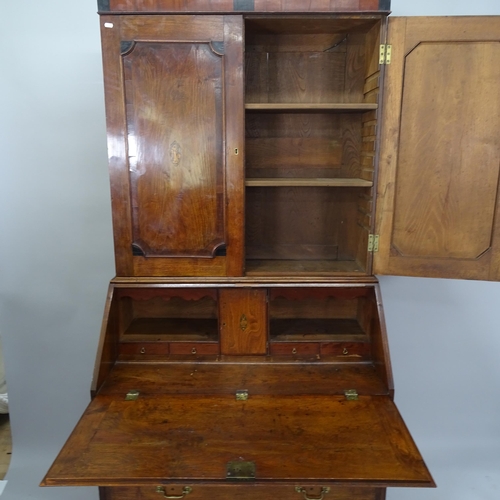 2045 - A 18th century oak 3-section bureau bookcase, the fall-front revealing a fitted interior with 4 long... 