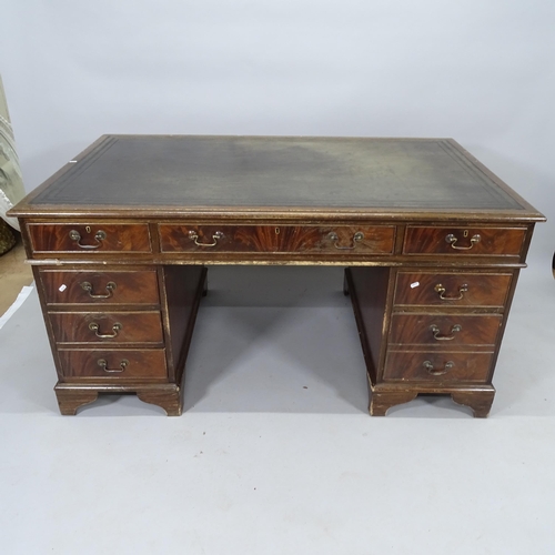 2054 - An Edwardian mahogany twin-pedestal writing desk, with inset tooled leather skiver and 9 fitted draw... 