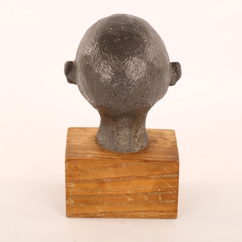 205 - An unusual mid-20th century solid lead head sculpture, on woodblock plinth, unsigned, height 22cm