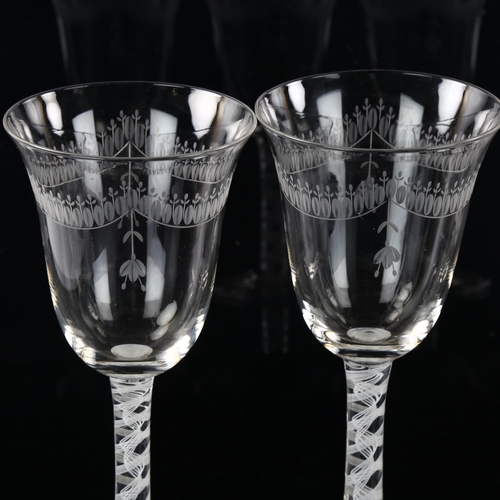 209 - A set of 4 wine glasses with engraved bowls and opaque milk twist stems, height 19.5cm