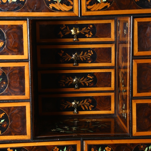 216 - An exceptional William and Mary oyster laburnum and marquetry inlaid cabinet on stand, covered in sp... 