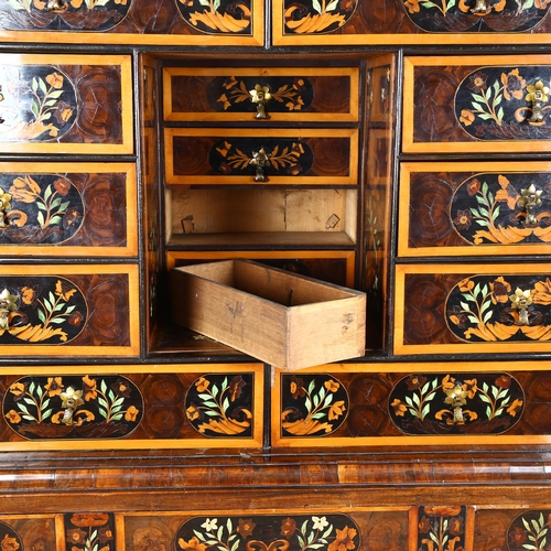 216 - An exceptional William and Mary oyster laburnum and marquetry inlaid cabinet on stand, covered in sp... 