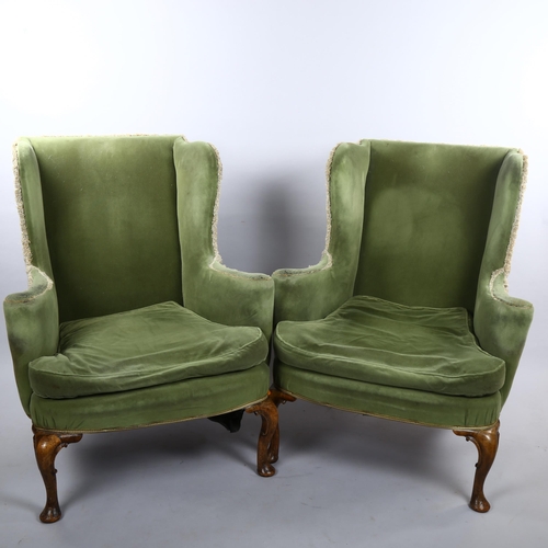 265 - A pair of 19th century upholstered wing armchairs in Queen Anne style, on walnut cabriole legs