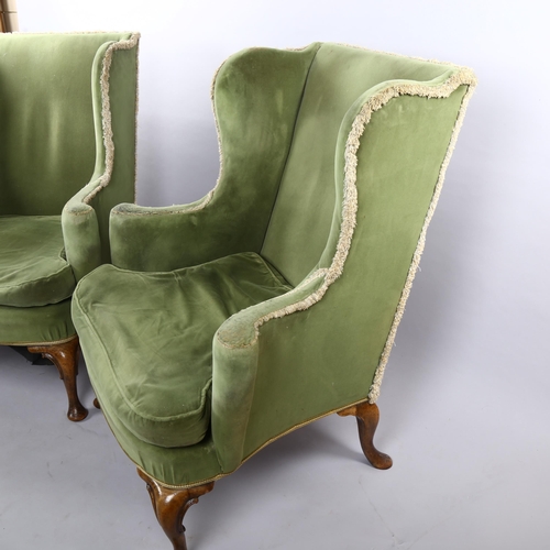 265 - A pair of 19th century upholstered wing armchairs in Queen Anne style, on walnut cabriole legs