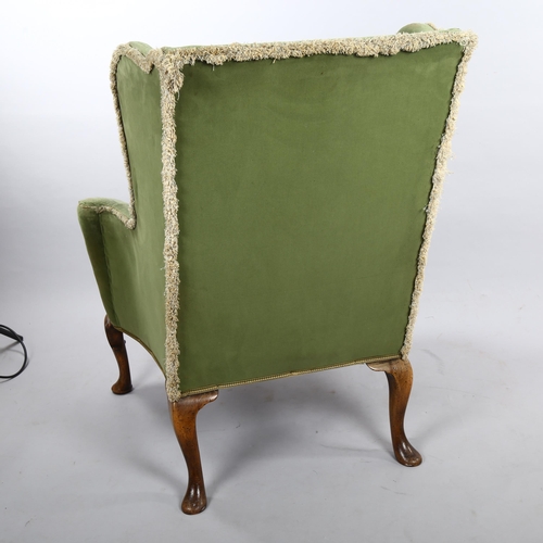 265 - A pair of 19th century upholstered wing armchairs in Queen Anne style, on walnut cabriole legs