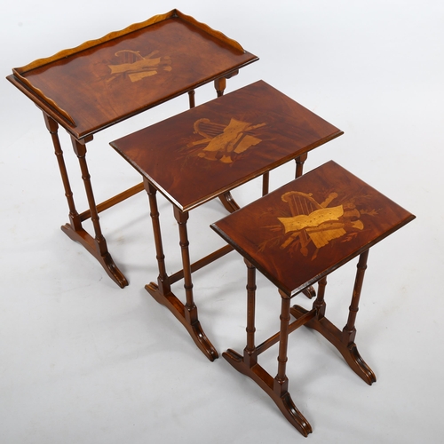 266 - A nest of 3 walnut occasional tables, with inlaid musical marquetry designs, largest width 56cm