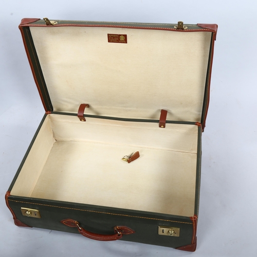 269 - 2 good quality leather and canvas-bound suitcases, by Papworth Everard of Cambridge, lengths 72cm an... 