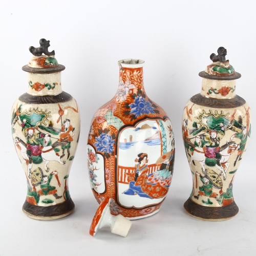 277 - A Japanese porcelain bottle and stopper, with hand painted decoration, 6 character mark, height 27cm... 