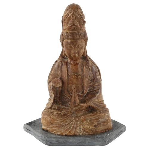 287 - An Antique Oriental carved wood Buddha, on later slate base, height 26cm