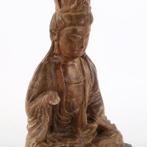 287 - An Antique Oriental carved wood Buddha, on later slate base, height 26cm