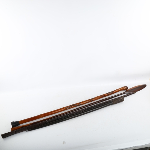 289 - A Tribal hardwood carved walking stick, length 100cm, a hardwood paddle-shaped stick, and an antelop... 