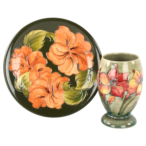 295 - MOORCROFT - African Lily design vase, height 17cm, and a Hibiscus pattern plate, diameter 26cm (2)