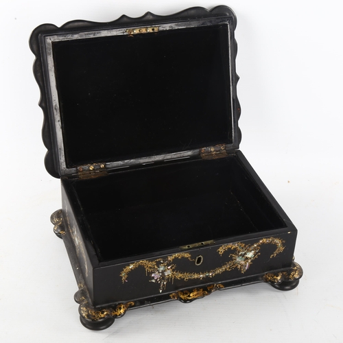 301 - A Victorian papier mache jewel box with inlaid mother-of-pearl decoration, width 25cm