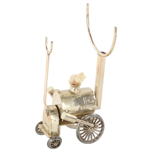 303 - A silver plated Brandy warmer, in the form of Stephenson's Rocket, height 19.5cm, length 10cm