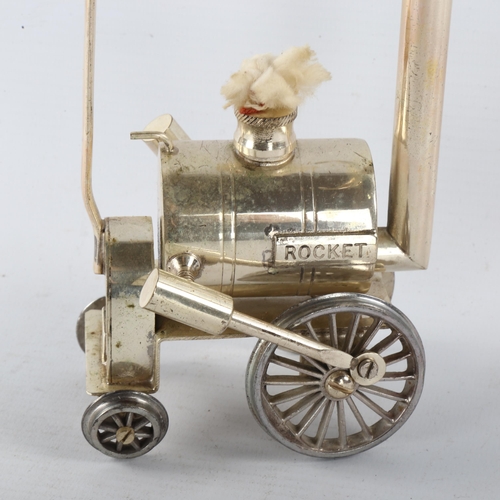 303 - A silver plated Brandy warmer, in the form of Stephenson's Rocket, height 19.5cm, length 10cm