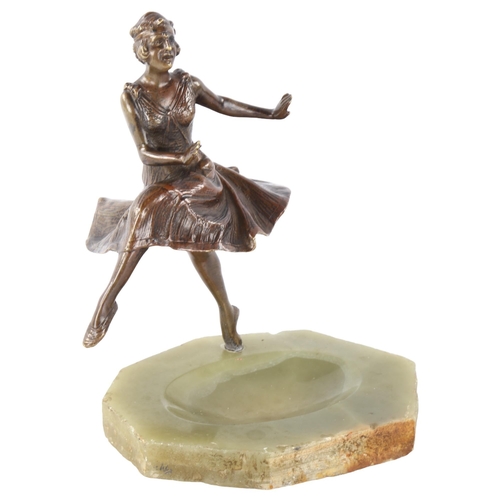 307 - A patinated bronze dancer, circa 1920, on onyx base, unsigned, height 18cm