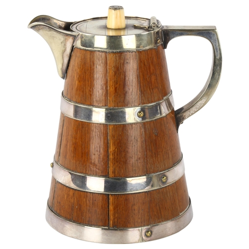 310 - WITHDRAWN - A Victorian oak and silver plate flagon with ivory knop, height 20cm