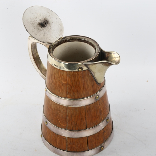 310 - WITHDRAWN - A Victorian oak and silver plate flagon with ivory knop, height 20cm