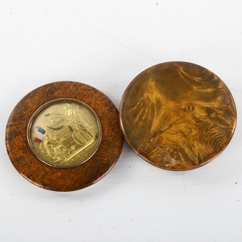 319 - A 19th century French circular burr-walnut box, the lid having an inset medallion commemorating the ... 