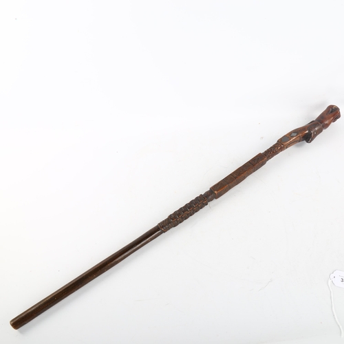 338 - An ornately carved 19th century Folk Art walking stick, with inlaid metal playing card design motifs... 