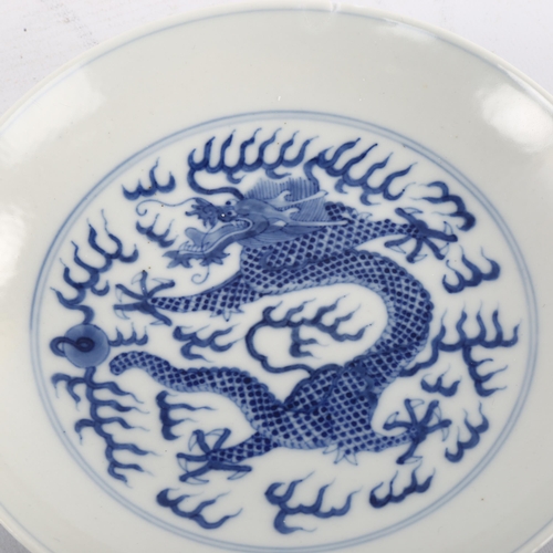 356 - A Chinese blue and white porcelain dragon dish, 6 character mark, diameter 16.5cm