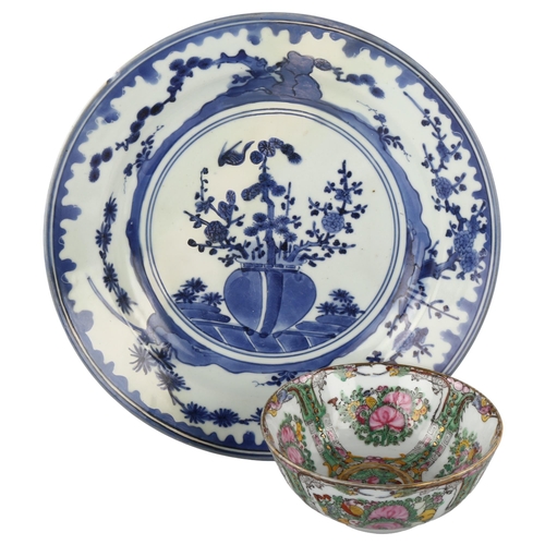 379 - A Chinese blue and white porcelain charger, diameter 31cm, and a smaller famille rose porcelain bowl... 