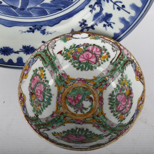 379 - A Chinese blue and white porcelain charger, diameter 31cm, and a smaller famille rose porcelain bowl... 