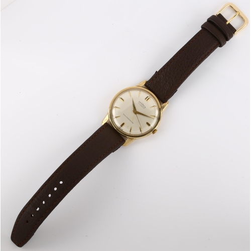 1032 - DERRICK - a 9ct gold automatic wristwatch, circa 1980s, silvered dial with gilt arrowhead hour marke... 