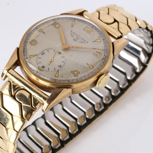 1042 - LONGINES - a mid-20th century 9ct gold mechanical bracelet watch, ref. 17702, circa 1948, silvered d... 