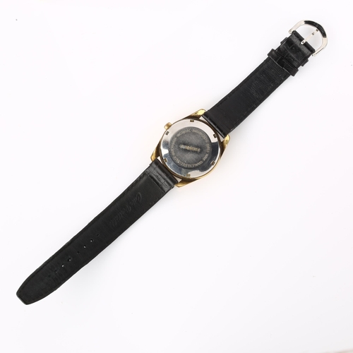 1046 - MUDU - a Vintage gold plated stainless steel automatic wristwatch, silvered dial with gilt baton hou... 