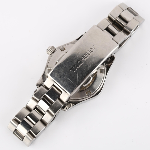 1053 - TAG HEUER - a lady's stainless steel Aquaracer quartz bracelet watch, ref. WAF1412, silvered dial wi... 