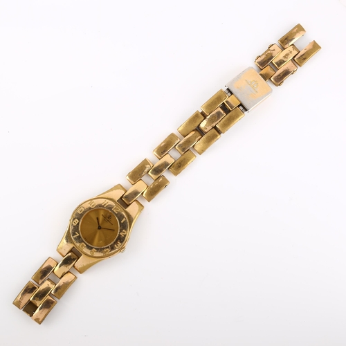 1056 - BAUME & MERCIER - a mid-size gold plated stainless steel quartz bracelet watch, champagne dial with ... 