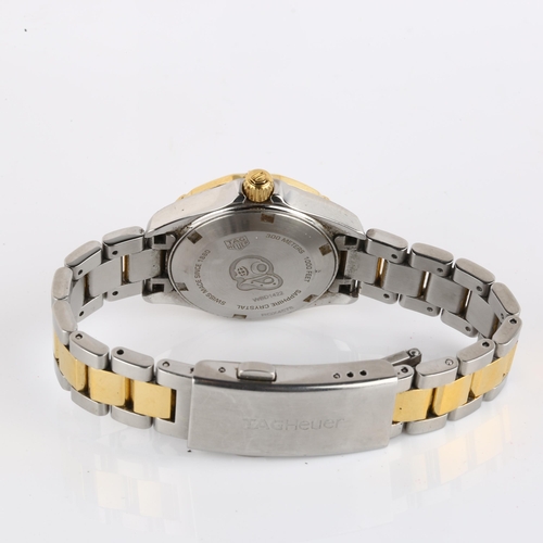 1058 - TAG HEUER - a lady's bi-metal Aquaracer 300M quartz bracelet watch, ref. WBD1422, mother-of-pearl di... 