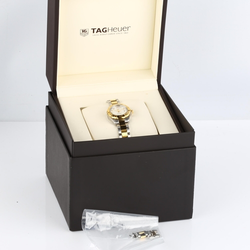 1058 - TAG HEUER - a lady's bi-metal Aquaracer 300M quartz bracelet watch, ref. WBD1422, mother-of-pearl di... 