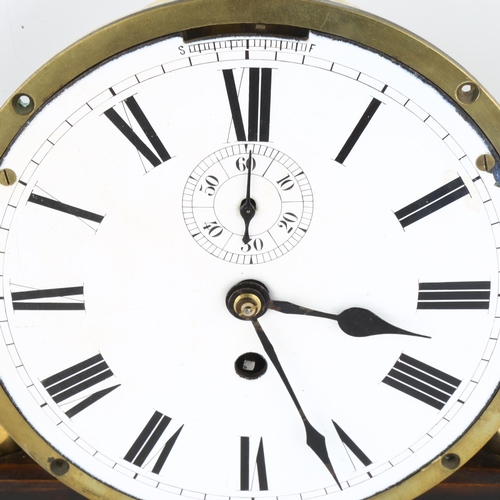 1074 - An Antique brass ship's bulkhead clock, white enamel dial with Roman numeral hour markers and subsid... 