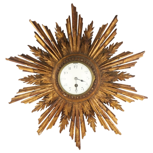 1077 - A French giltwood 30-hour sunburst wall clock, white enamel dial with Arabic numerals, overall diame... 