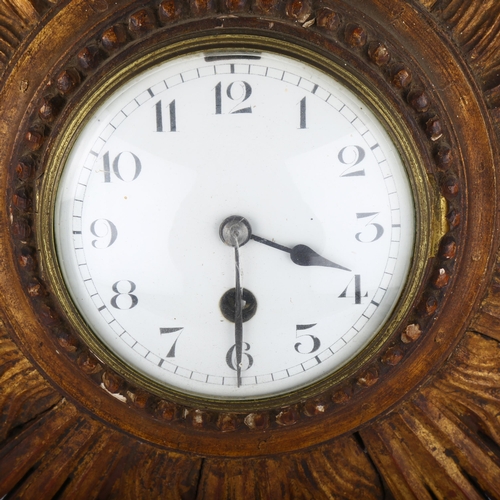 1077 - A French giltwood 30-hour sunburst wall clock, white enamel dial with Arabic numerals, overall diame... 