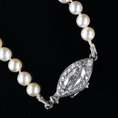 1100 - CARTIER - a natural saltwater pearl and diamond necklace, a graduated strand of 82 natural pearls of... 