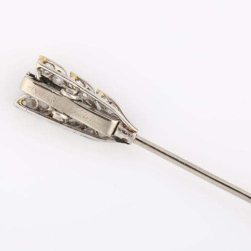 1101 - CARTIER - an Art Deco sapphire and diamond arrow jabot pin, the flights and tip set with calibre-cut... 