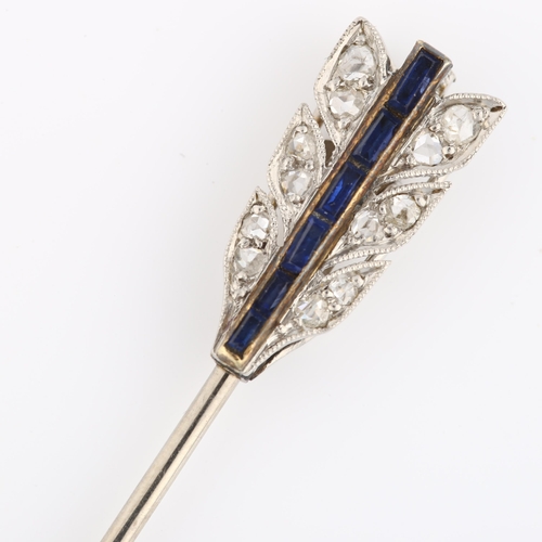1101 - CARTIER - an Art Deco sapphire and diamond arrow jabot pin, the flights and tip set with calibre-cut... 