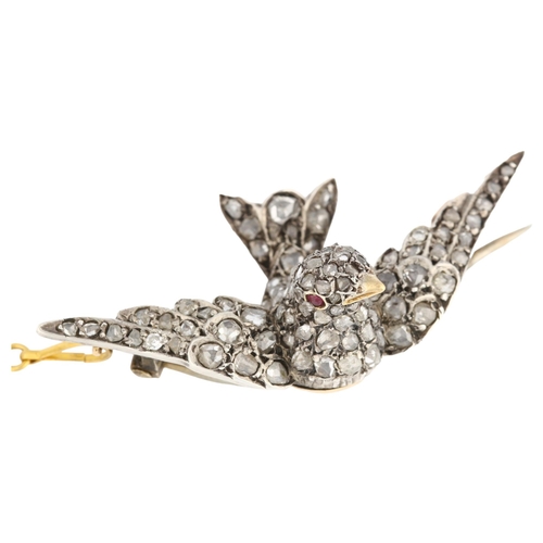 1110 - A late Victorian ruby and diamond swallow bird brooch, 3-dimensionally formed and pave set with rose... 
