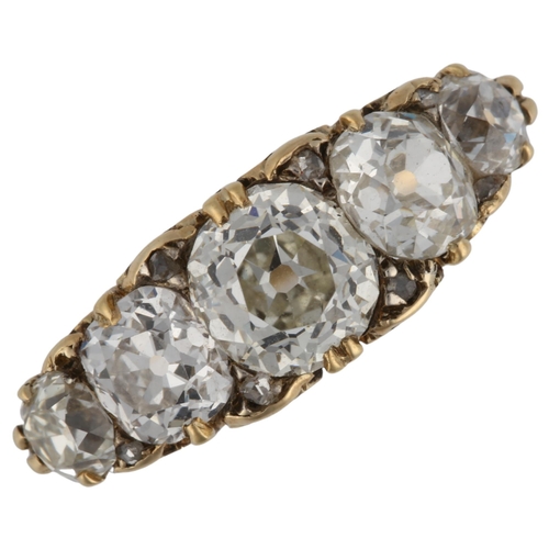 1120 - An Antique 18ct gold graduated five stone diamond half hoop ring, set with old cushion-cut diamonds ... 