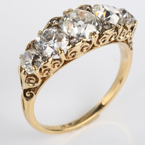 1120 - An Antique 18ct gold graduated five stone diamond half hoop ring, set with old cushion-cut diamonds ... 