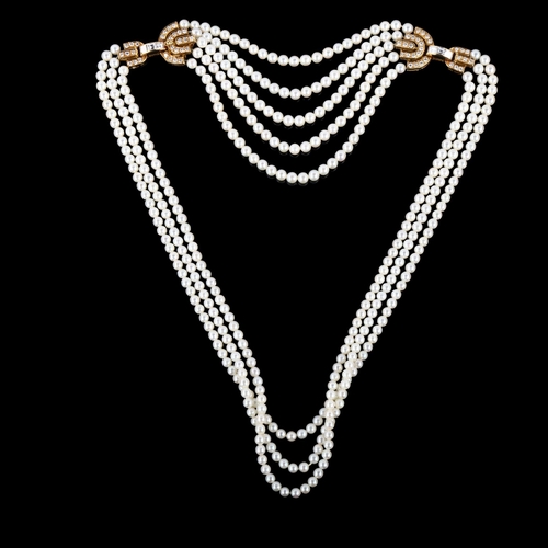 1122 - BOUCHERON - an 18ct gold multi-strand pearl and diamond necklace, the graduated pearls ranging from ... 