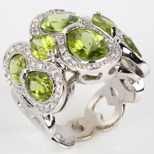 1123 - A large Italian 18ct white gold peridot and diamond cluster cocktail ring, set with oval mixed-cut p... 